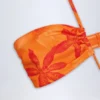 Bañador halter con aberturas Maranta en estampado de orquídeas naranjas