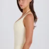 Bodis de jersey de algodón elástico con espalda cruzada en capas en color crema