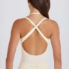 Bodis de jersey de algodón elástico con espalda cruzada en capas en color crema