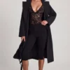 Body Zayla de encaje transparente con escote pronunciado y flecos en negro