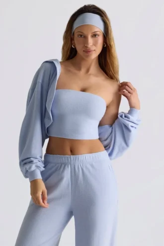 Bolero corto con capucha de jersey cepillado en azul suave