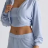 Bolero corto con capucha de jersey cepillado en azul suave