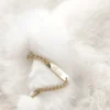 Bolero corto de pelo sintético Almerinda en blanco