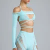 Bolero corto Pixie con adornos en azul hielo