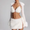 Bolero Vira con ribete de piel sintética en blanco