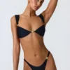 Braguitas de bikini atrevidas con adornos Volute en negro