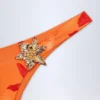 Braguitas de bikini atrevidas con detalles metálicos de Beqa en estampado Orange Orchid