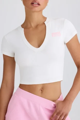 Camiseta corta de jersey de algodón elástico con estampado gráfico en blanco