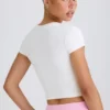 Camiseta corta de jersey de algodón elástico con estampado gráfico en blanco