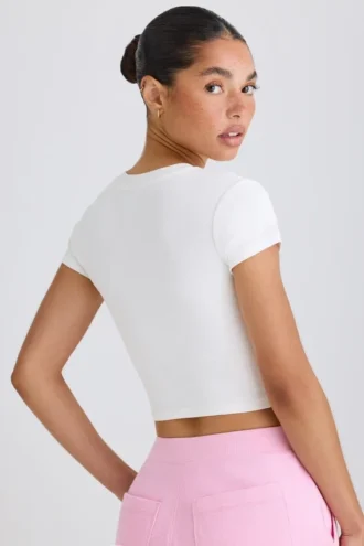 Camiseta corta de jersey de algodón elástico con estampado gráfico en blanco