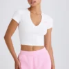 Camiseta corta de jersey de algodón elástico con estampado gráfico en blanco
