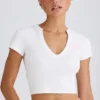 Camiseta corta de jersey de algodón elástico con estampado gráfico en blanco