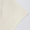 Camiseta larga con aberturas en color crema