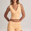 Pantalones Cortos Nina de modal con vuelta y talle medio en color melocotón
