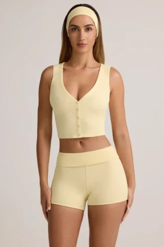 Camiseta sin mangas con botones y canalé de modal Lene en amarillo crema