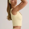 Camiseta sin mangas con botones y canalé de modal Lene en amarillo crema