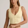 Camiseta sin mangas con botones y canalé de modal Lene en amarillo crema