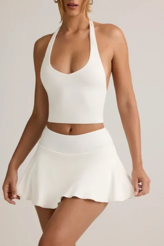 Camiseta sin mangas con cuello halter Kori de modal en blanco