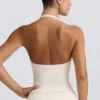 Camiseta sin mangas con cuello halter y espalda abierta en marfil jaspeado