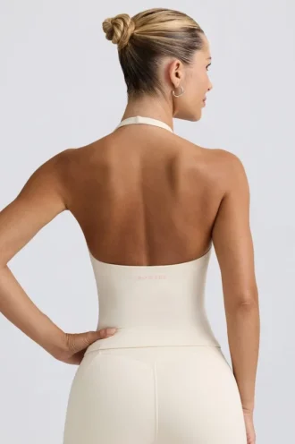 Camiseta sin mangas con cuello halter y espalda abierta en marfil jaspeado