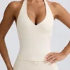 Camiseta sin mangas con cuello halter y espalda abierta en marfil jaspeado