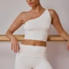 Camiseta sin mangas con un solo hombro y detalle retorcido en blanco suave