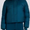 Chaqueta de esquí corta impermeable con capucha de pelo sintético en color verde azulado