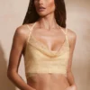 Corsé con cuello vuelto y adornos Selena en dorado
