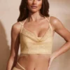 Corsé con cuello vuelto y adornos Selena en dorado