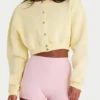 Cárdigan corto abotonado de jersey cepillado en amarillo suave