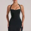 Falda ajustada de talle medio con abertura Tula en negro