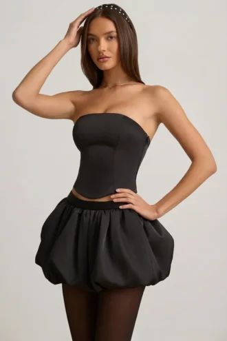 Falda Clemmy de talle medio con bajo abullonado en negro