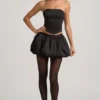 Falda Clemmy de talle medio con bajo abullonado en negro