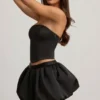 Falda Clemmy de talle medio con bajo abullonado en negro