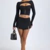 Falda de talle bajo con detalle de botones en modal «Dalla» en negro