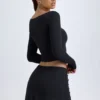 Falda de talle bajo con detalle de botones en modal «Dalla» en negro