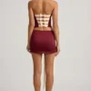 Falda de talle bajo con lazo de satén Carola en rojo vino