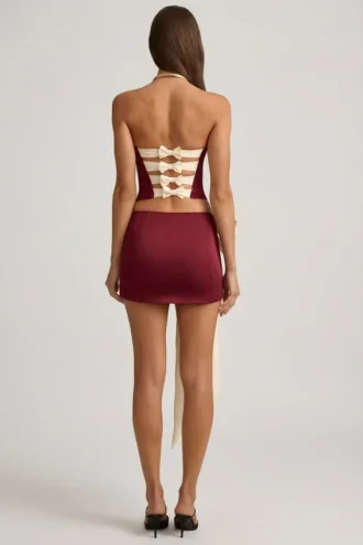 Falda de talle bajo con lazo de satén Carola en rojo vino