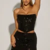 Falda drapeada con adornos Sybil en negro