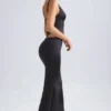Falda larga de corte sirena de talle medio Ceres en negro