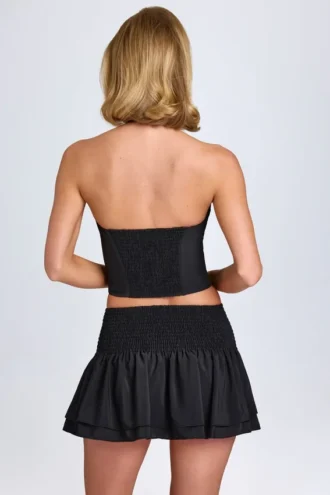 Falda micro con fruncidos y volantes Nellary en negro