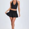 Falda micro con fruncidos y volantes Nellary en negro