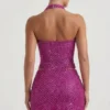 Falda micro de corte A con detalle de corazón adornado de Querida en color magenta