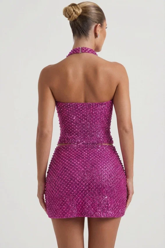 Falda micro de corte A con detalle de corazón adornado de Querida en color magenta