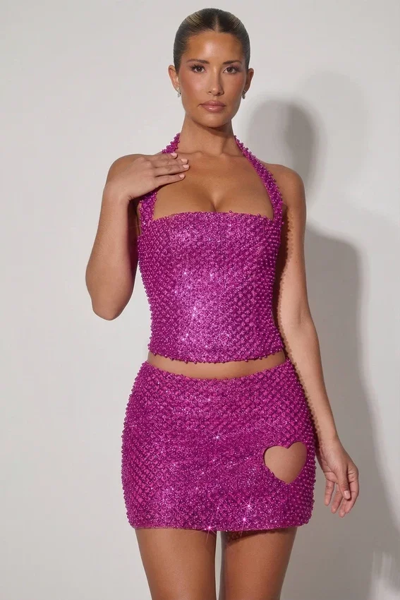 Falda micro de corte A con detalle de corazón adornado de Querida en color magenta
