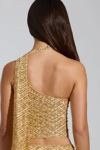 Falda micro de corte A y talle bajo con adornos Adhara en dorado