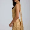 Falda micro de corte A y talle bajo con adornos Adhara en dorado