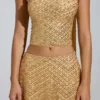 Falda micro de corte A y talle bajo con adornos Adhara en dorado