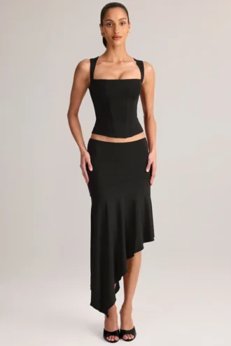 Falda midi asimétrica de talle bajo Niva Modal en negro