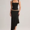 Falda midi asimétrica de talle bajo Niva Modal en negro